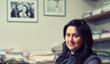 LinenMe founder Inga Lukauskiene reading a design magazine