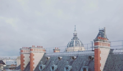Paris rooftops and a domed landmark