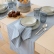 Table setting with blue striped Jazz linen table runners and napkins