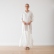 Full-length view of a woman holding an off-white Terra linen shopping bag
